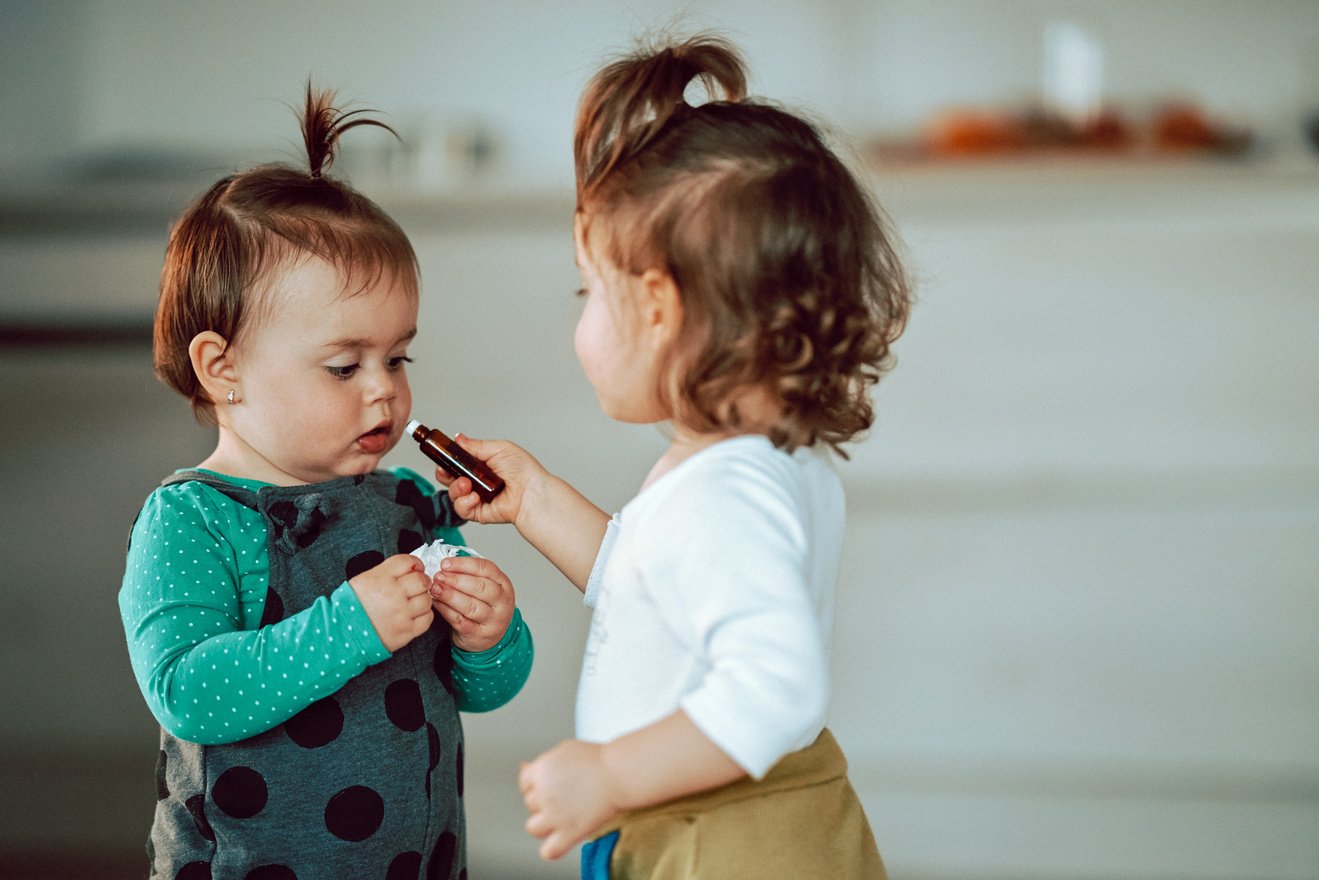 Kids smelling essential oil